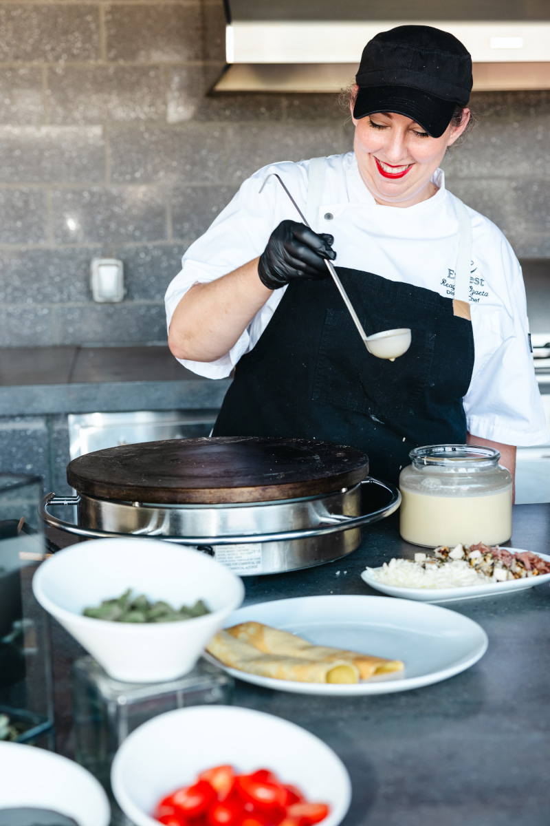 Taste & Savor catering staff, happily crafting dishes.